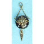 A Victorian cabochon garnet and diamond pendant, the round cabochon garnet overlaid with old-cut