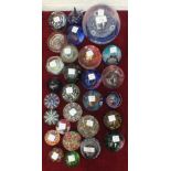 A large group of twenty-eight glass paperweights, including three dated examples: 2 x Jubilee 1977