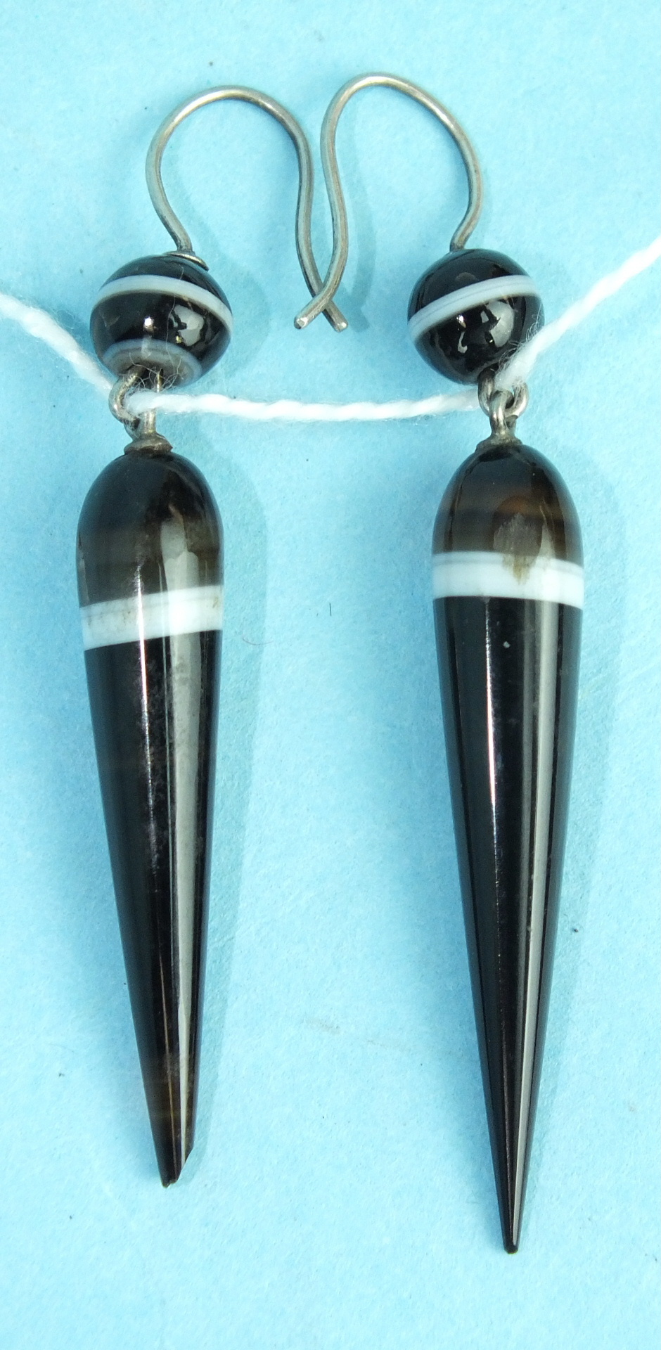 A pair of banded agate drop earrings with white metal ear wires, total length 61mm, (one a/f).