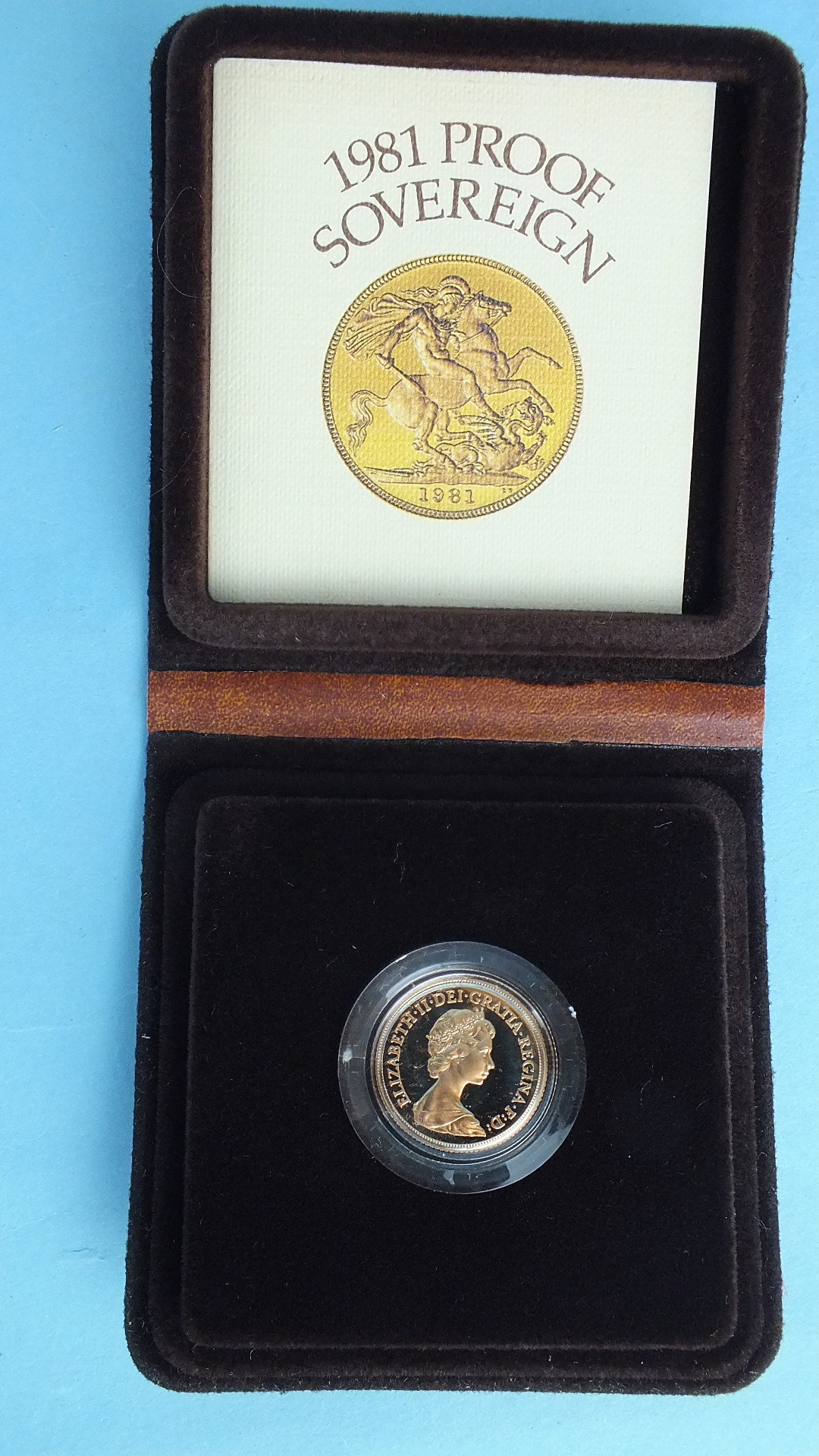 A Royal Mint 1981 proof sovereign, in case.