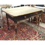 A rustic pine kitchen table fitted with two drawers, 122cm wide, 73cm high and a stained pine