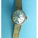 Tissot, a ladies 'Stylist' 9ct gold wrist watch on gold mesh bracelet, total weight 16.5g, boxed.