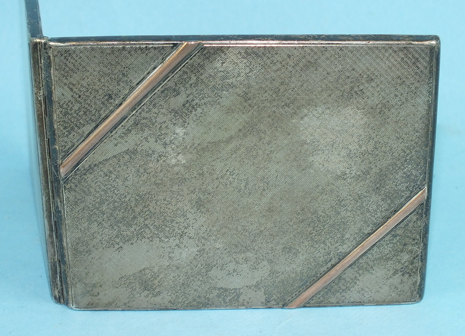A silver engine-turned cigarette case, Birmingham 1930, 10.5 x 8.2cm, ___3½oz, (inscribed to