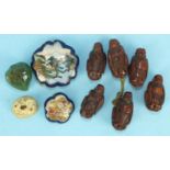 Six Oriental coquilla nut beads, carved in the form of men, a Satsuma hat pin top and other items.