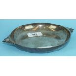 A silver circular two-handled shallow dish, 18cm, Sheffield 1945, ___8oz.
