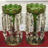 A pair of 19th century green and gilt glass lustres with ivy leaf and floral gilding and each with