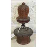 A large carved coquilla nut nutmeg grater in the form of a mitre, on nutmeg storage box in the