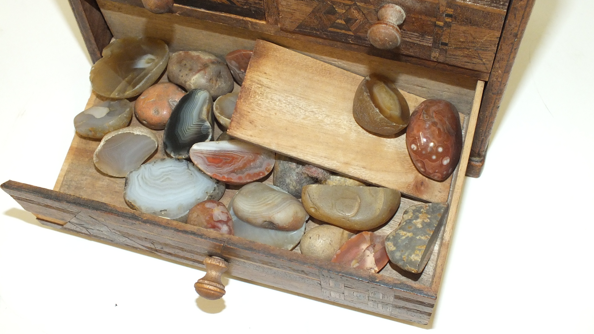 A small wooden chest with an arrangement of five marquetry-decorated drawers, 18cm wide, 15.5cm - Image 3 of 4