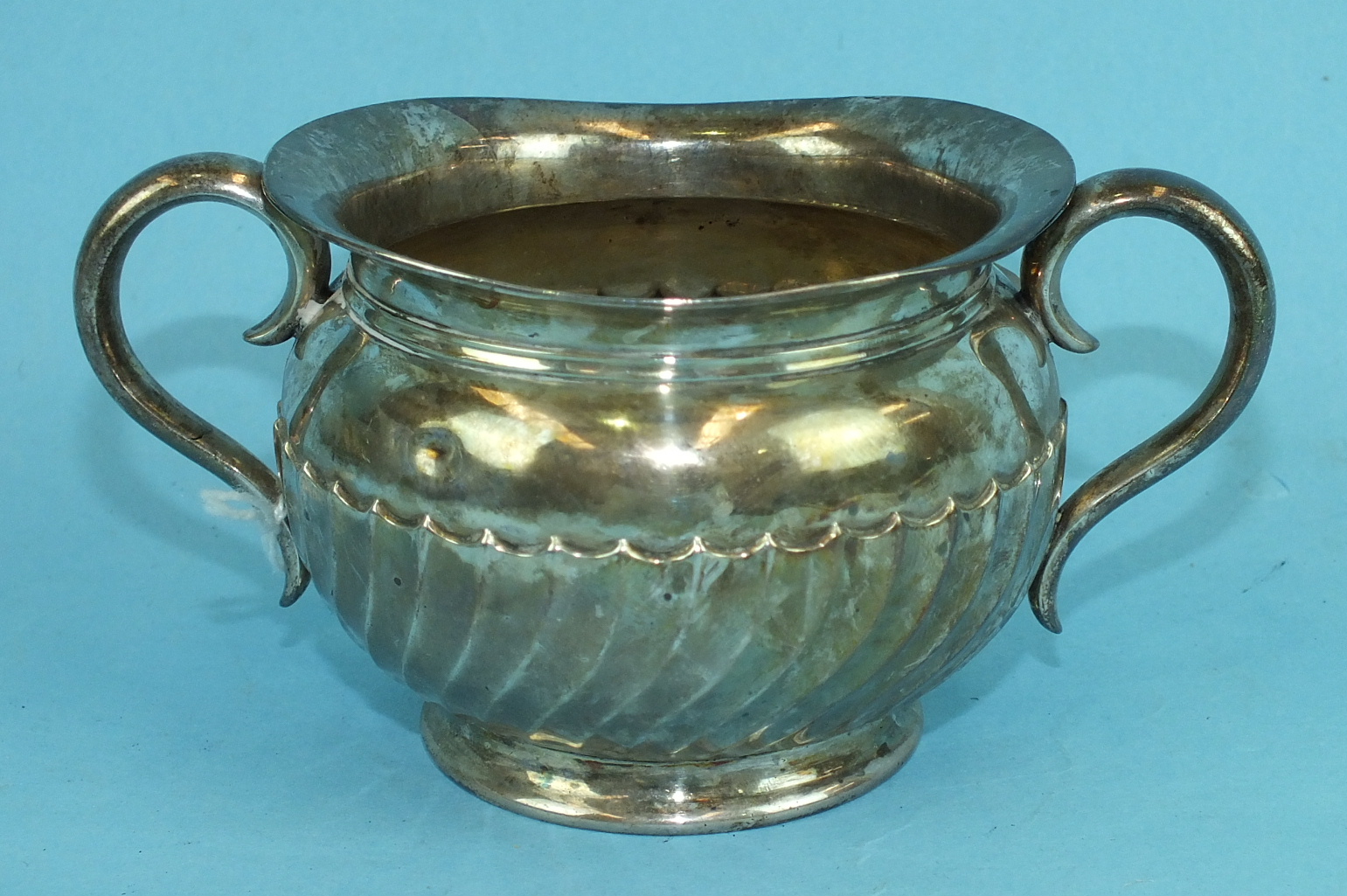 A silver two-handled sugar bowl with gadrooned decoration, London 1903, ___7oz.
