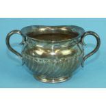 A silver two-handled sugar bowl with gadrooned decoration, London 1903, ___7oz.