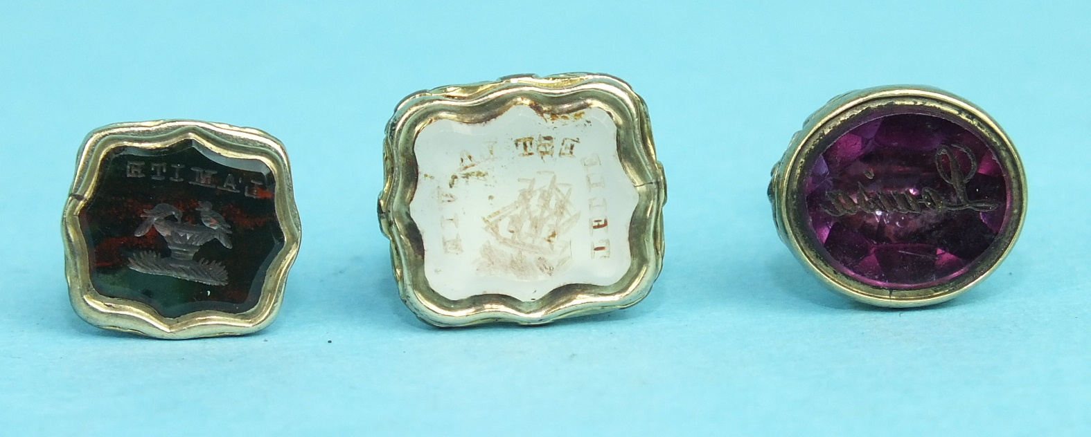 A small gold-plated fob seal, the chalcedony intaglio inscribed 'Telle Est La Vie', around a ship, - Image 2 of 2