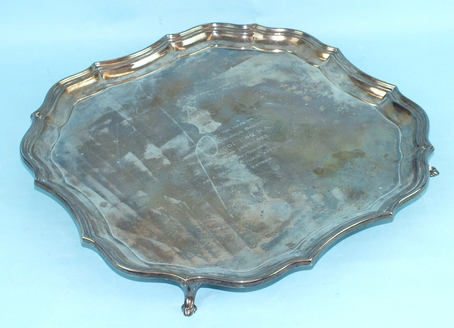 A silver square Chippendale-style salver of four hoofed feet, 35.5cm, engraved inscription to top,