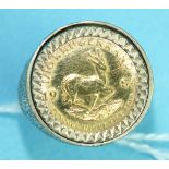 A 1984 1/10 Krugerrand coin mounted in a 9ct gold ring, size N, 7.6g.