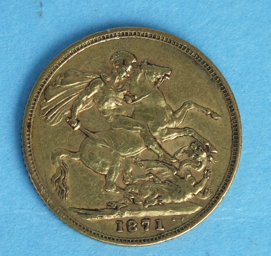 An 1871 Victoria (young head) sovereign.