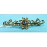 A Victorian gold brooch centrally-set a sapphire and rose-cut diamond flower, between diamond-set