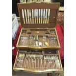 A set of twelve engraved silver-plated fish eaters in fitted walnut box marked 'Alex Duncan,