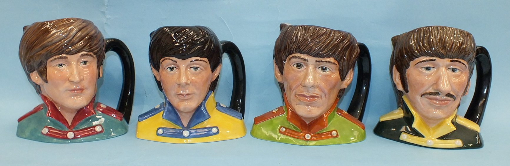 A set of four Royal Doulton 'The Beatles' character jugs, 'Paul McCartney' D6724, 'John Lennon'