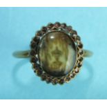 A George III mourning ring with oval ivory glazed panel depicting an urn below a weeping willow,
