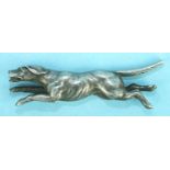 A white metal half-model of a running hound, 45mm long and two metal models of standing hounds, (