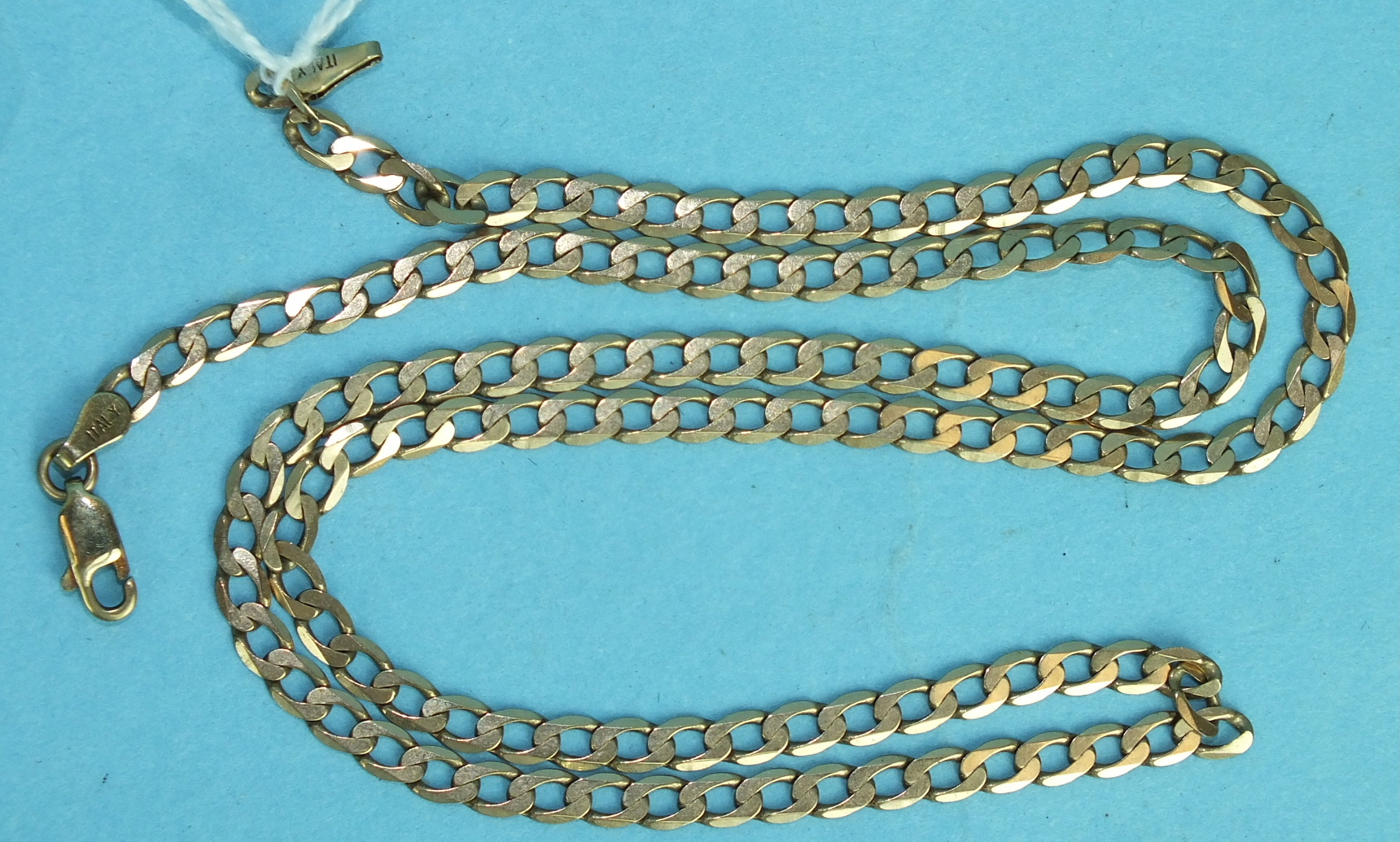 A 9ct gold neck chain of flattened curb links, 52cm long, 8.6g.