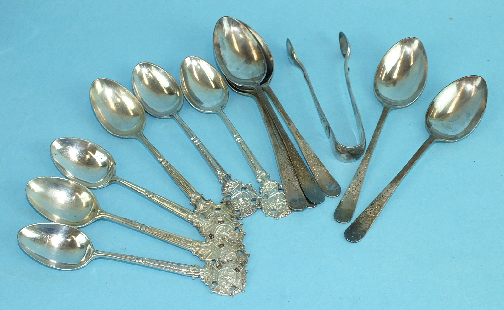 A set of six engraved teaspoons with matching tongs, Sheffield 1918 and a set of six Rifle Club