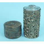 A Chinese white metal circular pill box and cover embossed with dragon decoration, 4.5cm diameter,