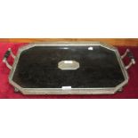 A Victorian ebonised wood two-handled serving tray of octagonal shape, with pierced plated gallery
