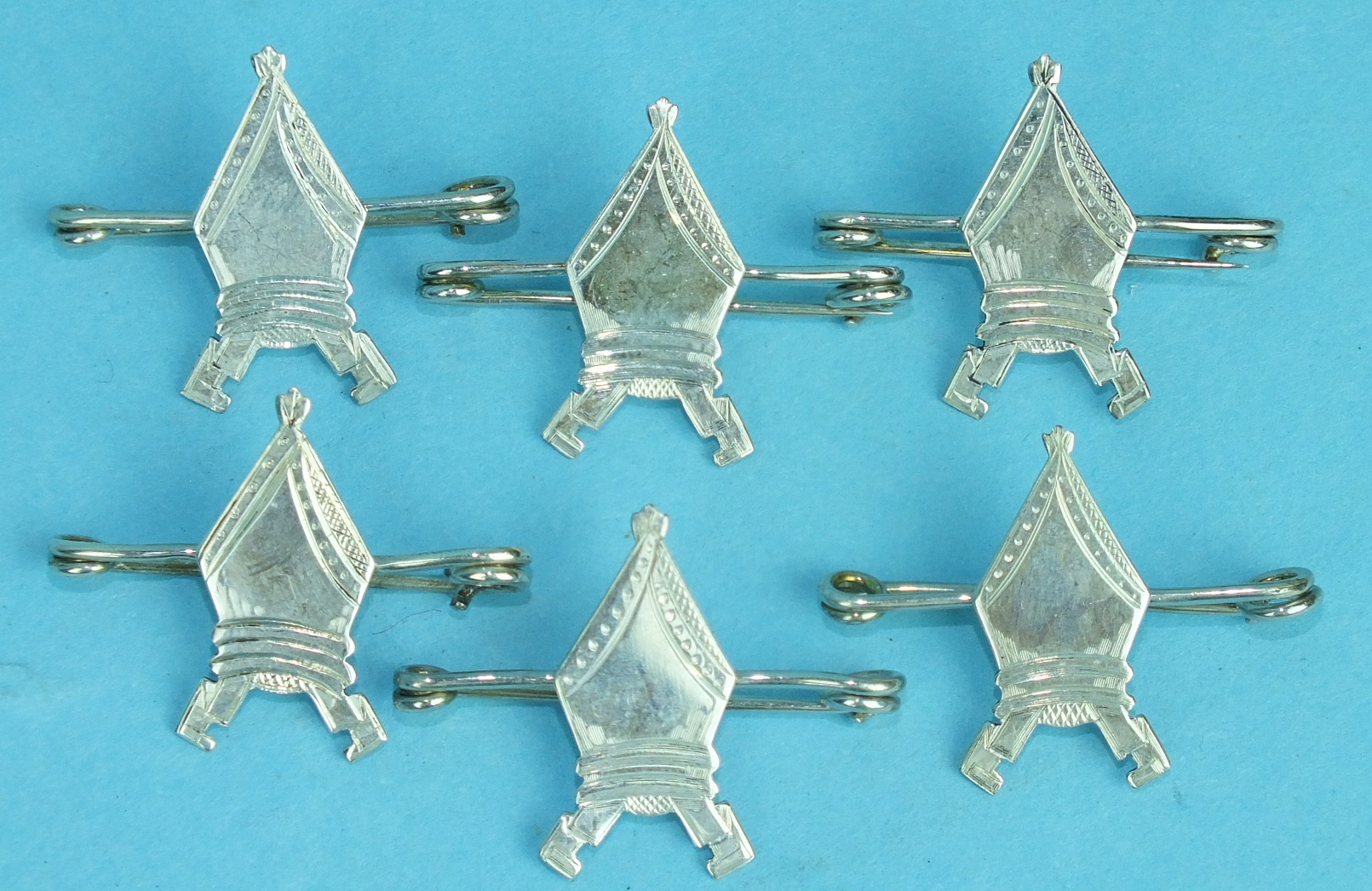 Six silver brooches in the form of mitres, 13.8g, (6).