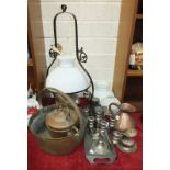 A brass oil lamp on hanging metal fitting, a brass jam pan with metal handle, a copper quart