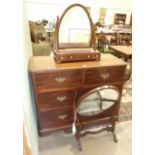 A mahogany dressing chest of two short and two long drawers, 106cm wide, an oval mahogany dressing