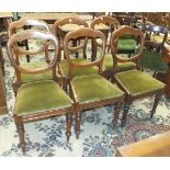 A set of six Victorian mahogany balloon-back dining chairs with drop-in seats, on turned legs, (6).
