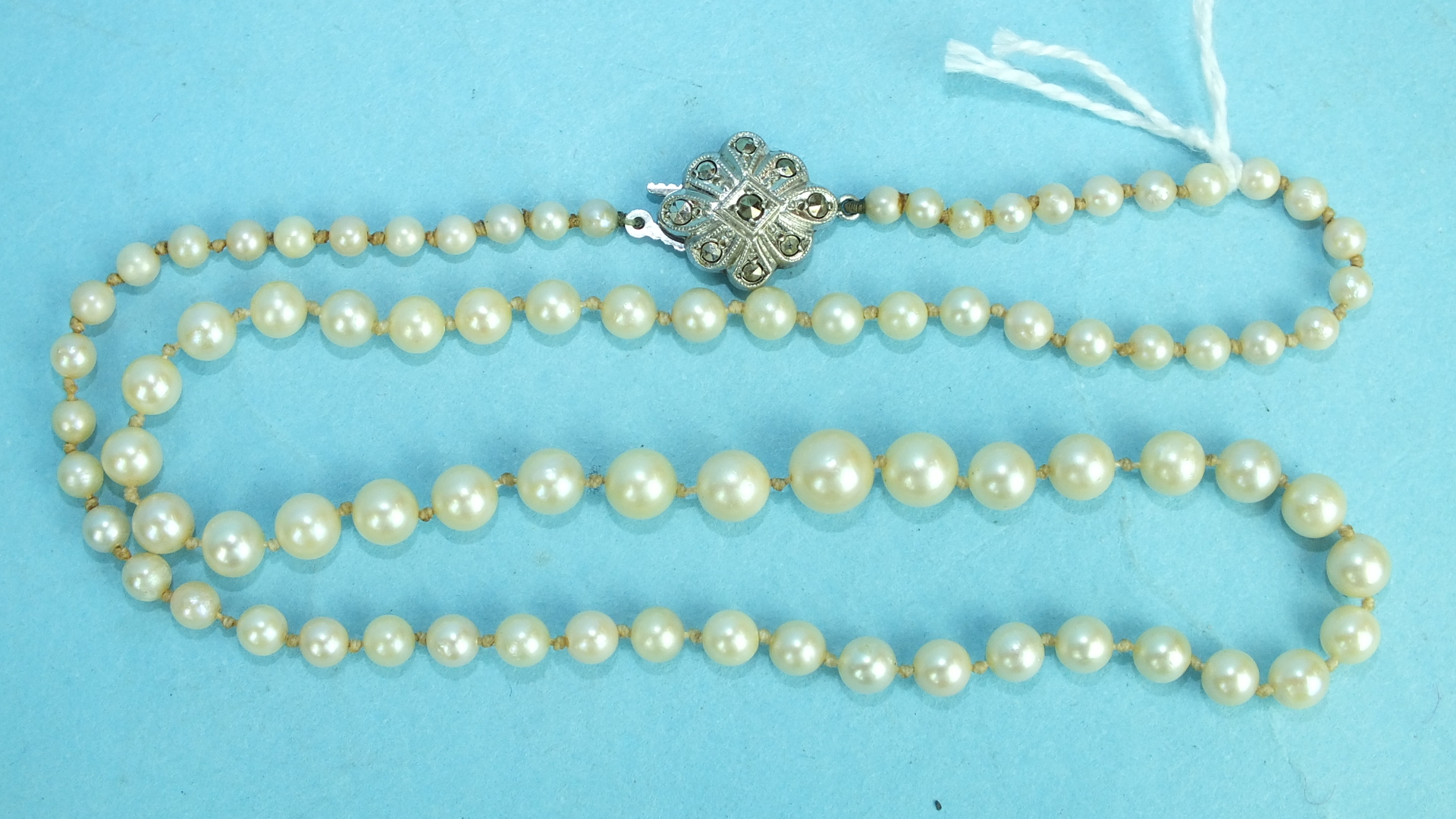 A string of graduated cultured pearls.