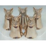 A set of four mid/late-20th century fox mask stirrup cups and one other, similar, 8cm high, (5).