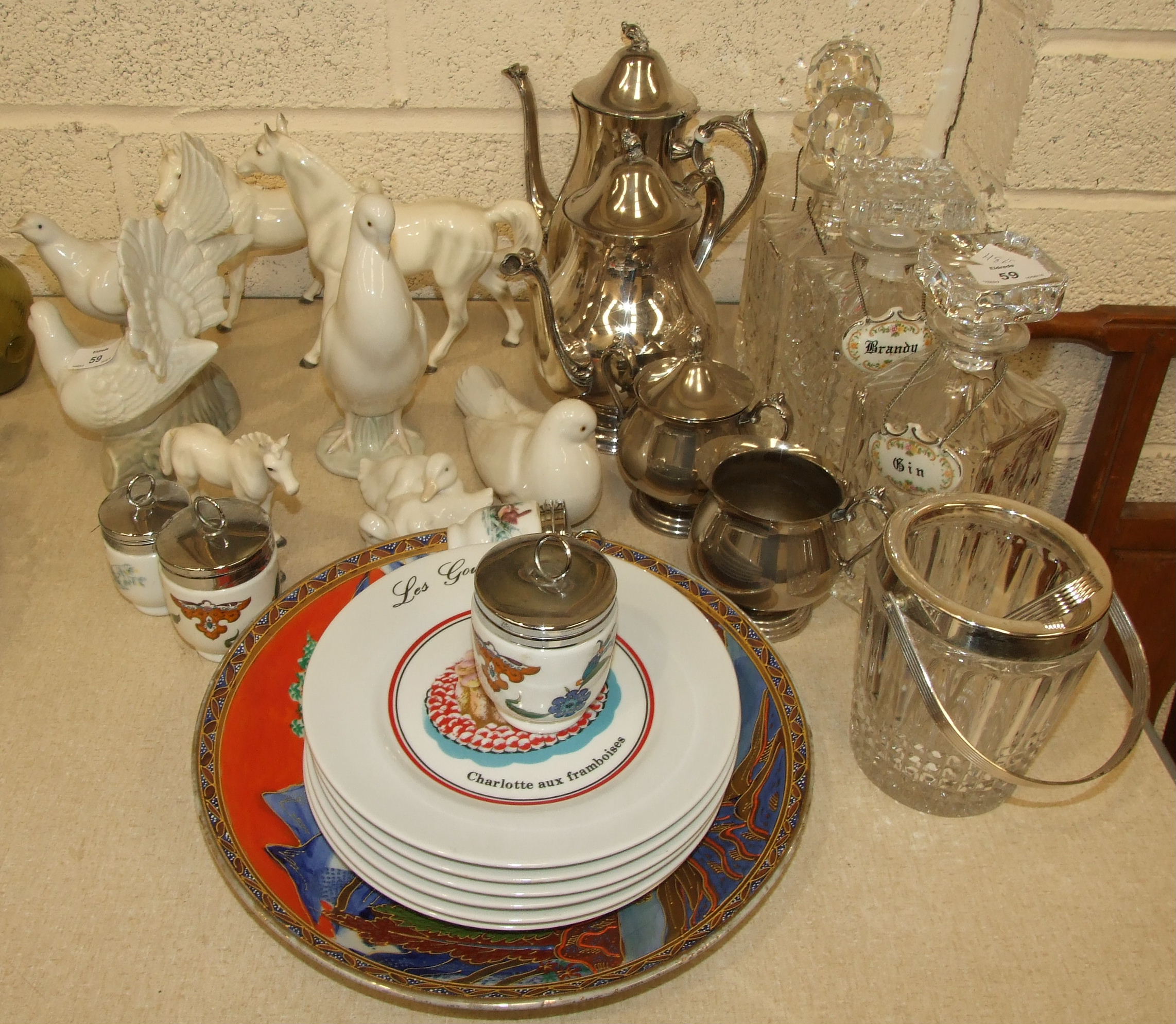 Three Nao porcelain figures of birds, a glass ice bucket and other items.