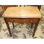 A Victorian single-drawer occasional table with a rectangular top above a frieze drawer, on turned