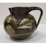 C H Brannam, Barum, a brown-glazed jug of compressed form, with incised marks beneath, dated 1892.