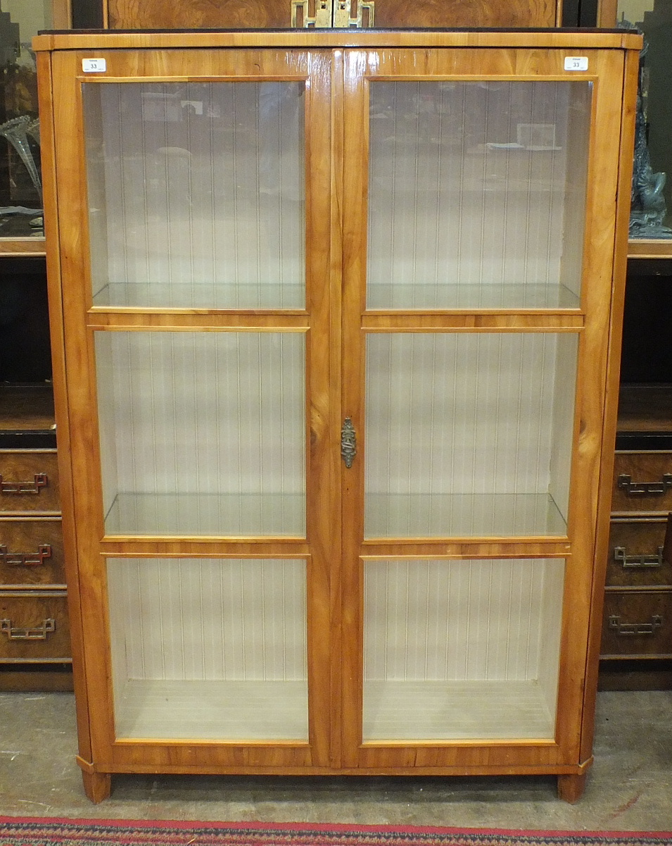 A Continental satinwood display cabinet, the rectangular top above a pair of glazed doors, 102cm - Image 3 of 3