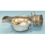 A silver cream jug, 7cm high, London 1934 and a silver napkin ring, Sheffield 1896, total weight