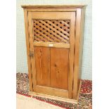 A stripped pine food cupboard, the rectangular top above a single door, 66cm wide, 112cm high.