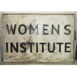 A large white-painted wooden sign stencilled 'Women's Institute', 62.5 x 92cm.