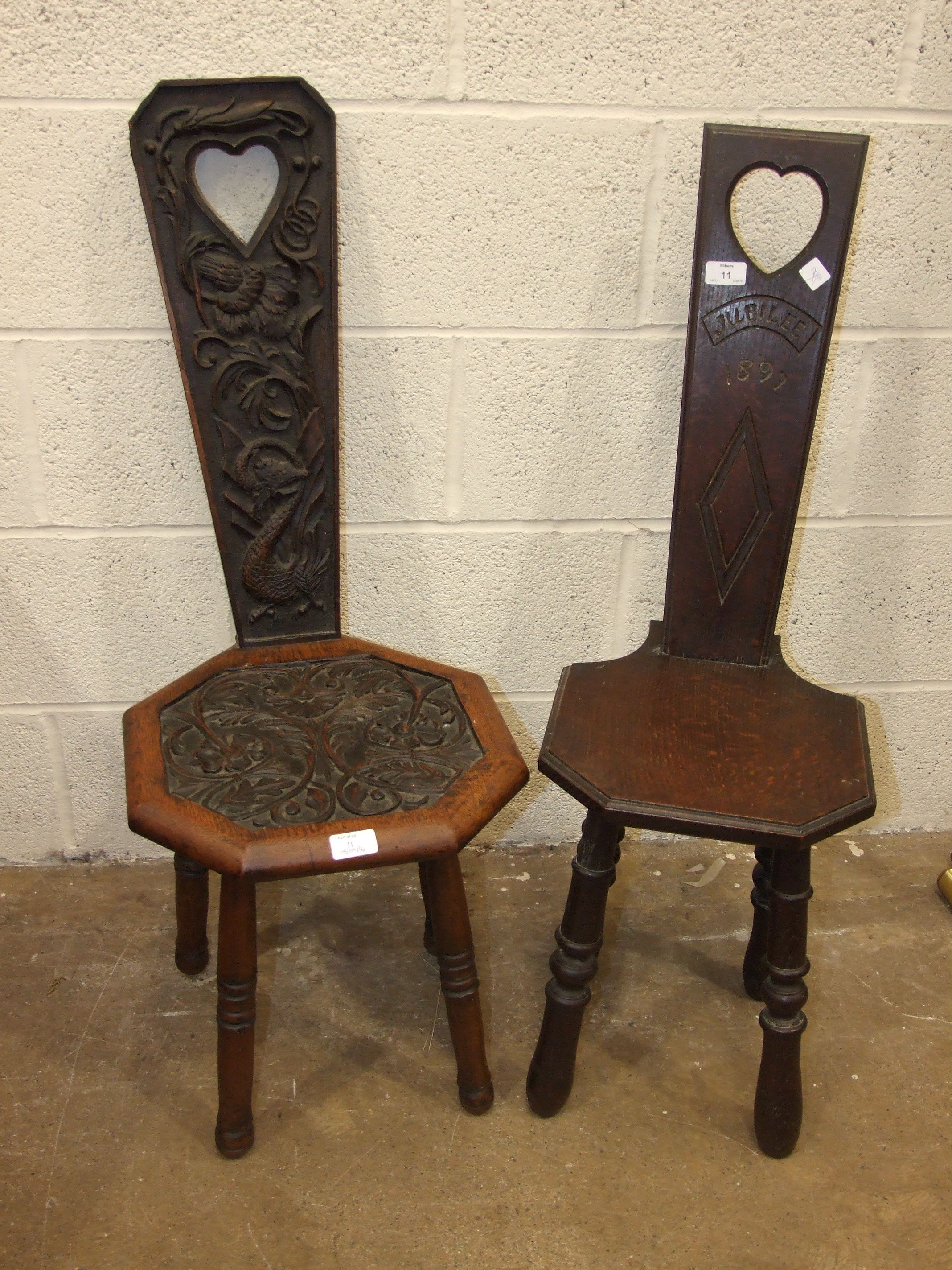 Two oak spinning chairs, one dated '1907', the other carved 'Jubilee 1897' and a walnut brass-