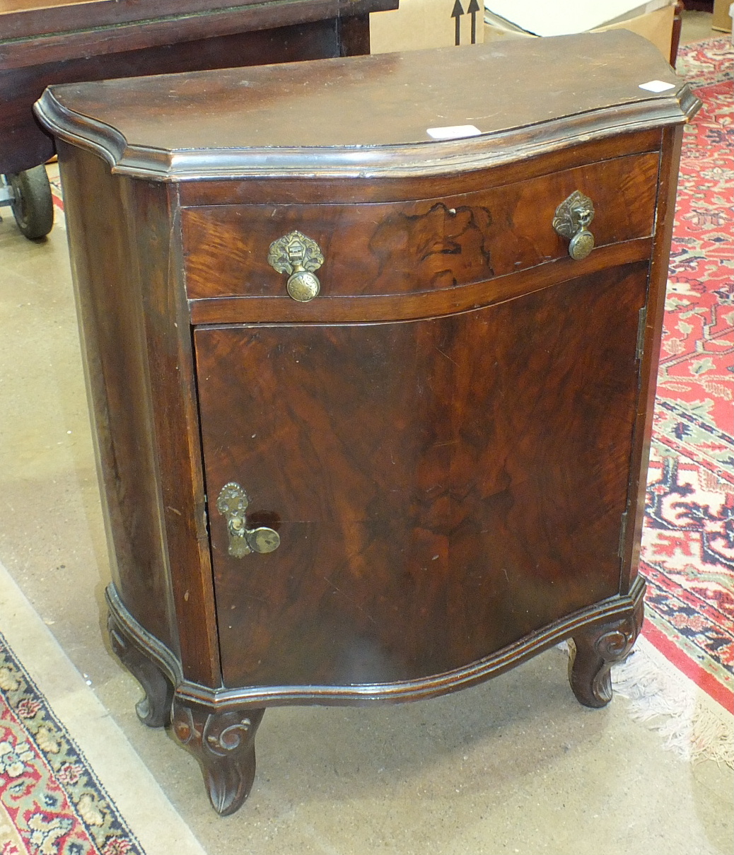 A small reproduction walnut serpentine side cupboard, 59cm wide and a reproduction walnut fold-