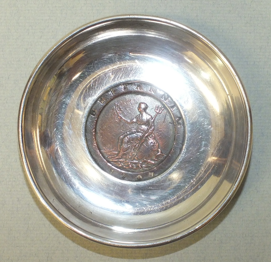 A silver pin tray by Sampson Mordan & Co, of circular form, the base inset a 1797 cartwheel 2d coin,