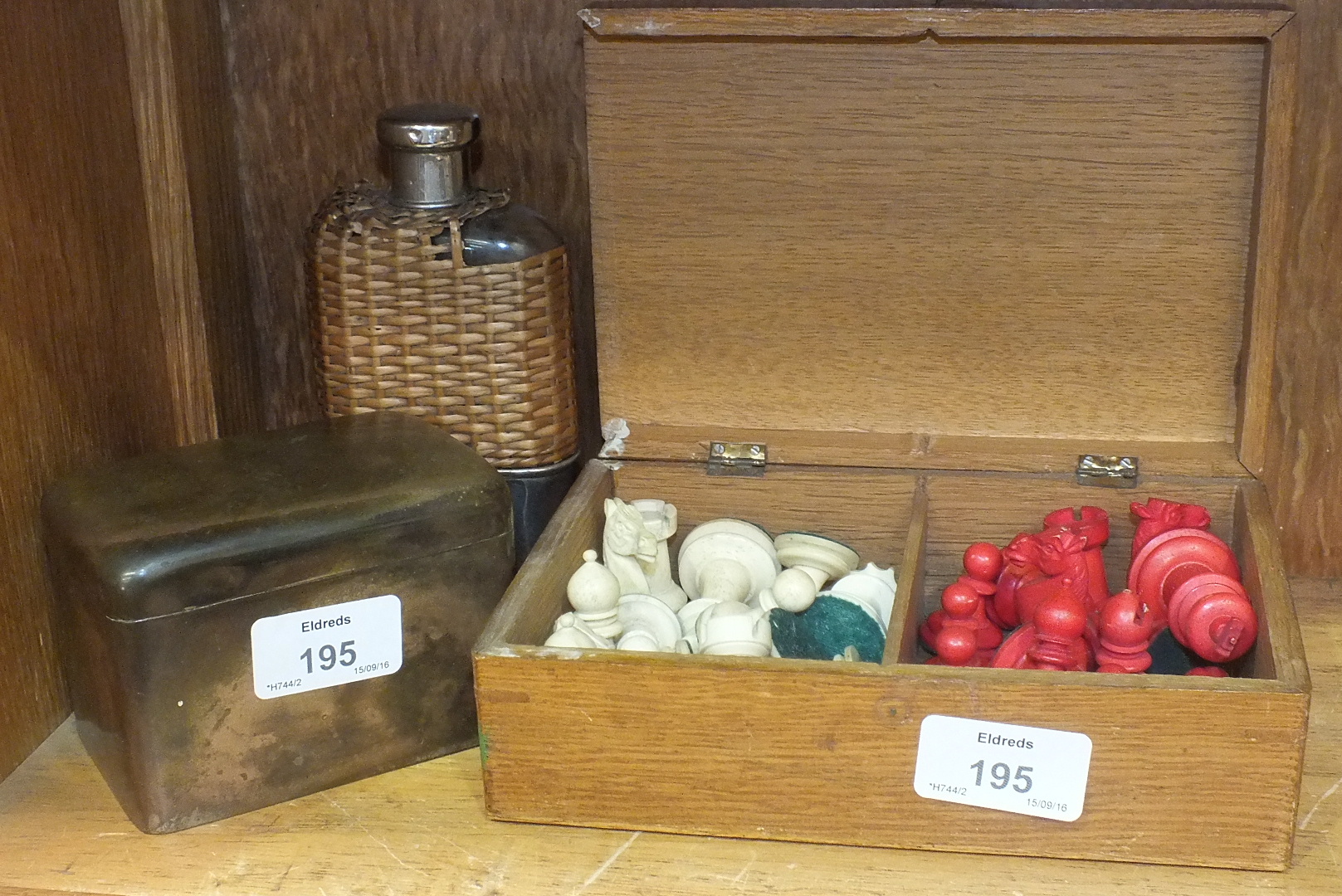 A stained red and white chess set, (some pieces a/f), in wooden box, a stained black and white