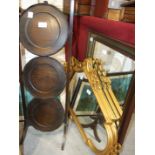 A pair of modern gilt frame shaped mirrors, one other mirror, an oak folding cake stand and three