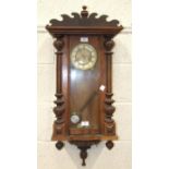 A Continental rosewood Vienna-style striking wall clock, the dial marked 'Germany', 82cm high.