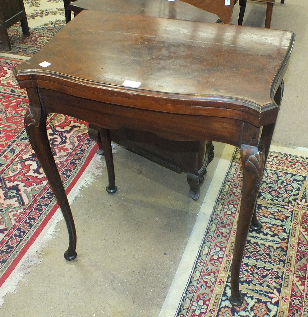 A small reproduction walnut serpentine side cupboard, 59cm wide and a reproduction walnut fold- - Image 2 of 2