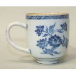 A late 18th century Chinese cup decorated with underglazed blue floral sprays, 6cm high.