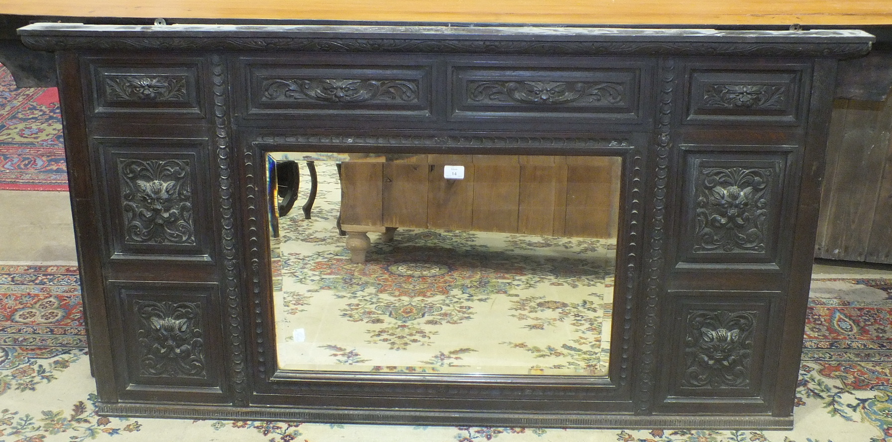 A carved oak overmantel mirror with central plate, 160 x 84cm, (sideboard top) and a late-