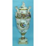 A large 19th century Continental porcelain vase and cover painted with an oval panel of a courting